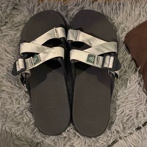 dark grey chacos with light blue and grey straps
